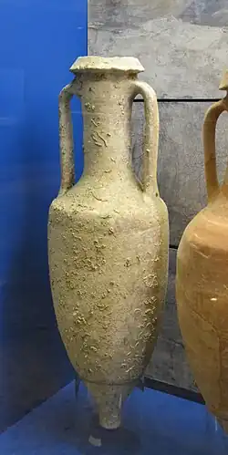 A ceramic storage vessel, with two handles and a thin neck