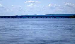A long box girder bridge seen from several kilometers (miles) away.