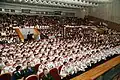 Members of the school assembled in the auditorium on its 75th anniversary.