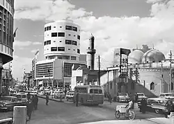 The Murjan Mosque and the Abboud Building on the street by Latif al-Ani.