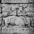 Men on lions.