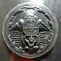 Seal of Chai Nat Province (a garuda upholding the dhammacakka in front of the mountain and river), Wat Sri Suphan, Chiang Mai