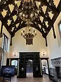 Looking to the south end of the hall and through to the small inner room beyond.
