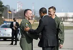 Obama arrives in Ramstein to meet with wounded soldiers and confer with military generals.