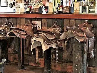 The bar in the Saloon has stools with saddles on them.