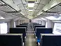 Interior of a 583 series set, with fixed 4-seat bays, May 2008