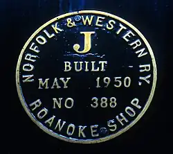 A close-up of a steam locomotive's builder's plate