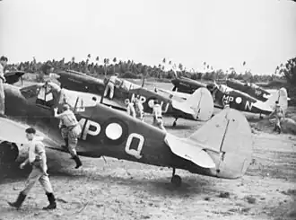 Members of No. 86 Squadron RAAF about to take off in their Kittyhawk fighters at Merauke in April 1944