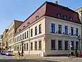 The neoclassical tenement house from the 18th century at 9 Grodzka Street, at the corner with Staromłyńska Street, next to the White Eagle Square.