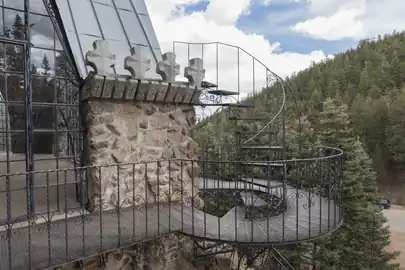 A rocky twist and turn along a soaring tower of Bishop Castle.