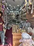 A thathera selling utensils in Thathera market