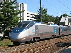 Silver and blue electric locomotive with a single cab