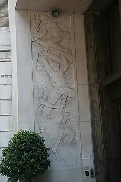 One of two reliefs on the side walls of Adelphi entrance by Newbury Abbot Trent. This relief is titled: Labour on the River. Photograph shown courtesy John Linwood. [50]