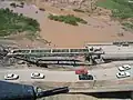 Aerial view of the nearly complete erection of a Medium Girder Bridge over the Kazer River, Mosul, Iraq, 2003.