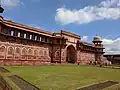 The 16th century Jahangiri Mahal at the Agra Fort has a four-centred arched gateway flanked by four-centred blind arches.