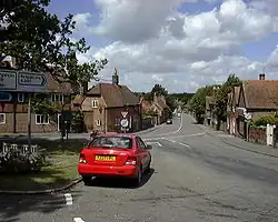 View of a village street lined with red brick buildings