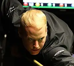 Allan Taylor playing a shot