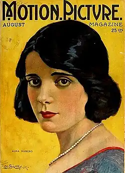 Magazine cover illustration showing Rubens with black hair and blue dress against yellow background, wearing a pearl necklace