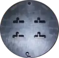 Front side of a four family die. The die is 228&nbsp;mm (9.0&nbsp;in) in diameter.