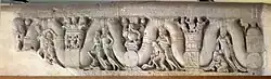 Coping stone relief with garland bearers