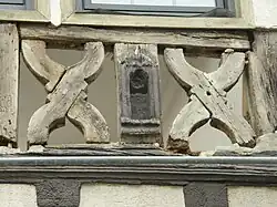 Two curved saltires also called St. Andrews crosses during repairs to a building in Germany: The infill has been removed.