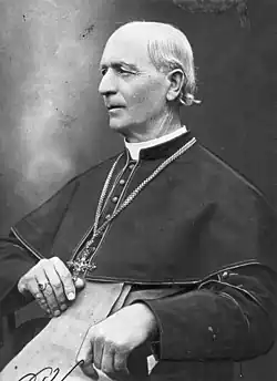 A black-and-white image of Hlinka while seated