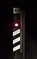 A red Ankaray signal located at Kolej station
