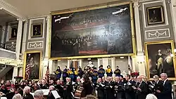 Apollo Club performing in Faneuil Hall with members of Bach, Beethoven, & Brahms Society, Heritage Chorale, and VOICES Boston Children's Choir