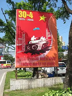 A sign depicting a Viet Cong tank crashing through the gates of the Presidential Palace