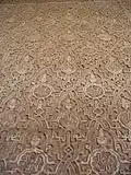 Sebka pattern filled with other motifs in carved stucco decoration at the Alhambra in Granada, Spain (14th century)