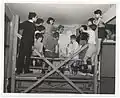 Red Hook children on scaffolding with the artist