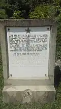 Bilingual Yugoslav era monument to fallen partisan