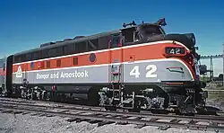 Brown, red, and gray locomotive