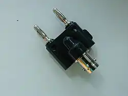 Adapter between a female BNC connector and banana plugs manufactured by Pomona.