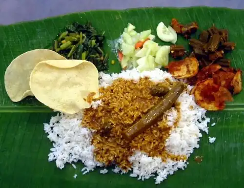 Image 22A typical serving of banana leaf rice. (from Malaysian cuisine)