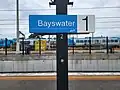 Platform 1 signage, November 2022. The train maintenance depot is in the background.