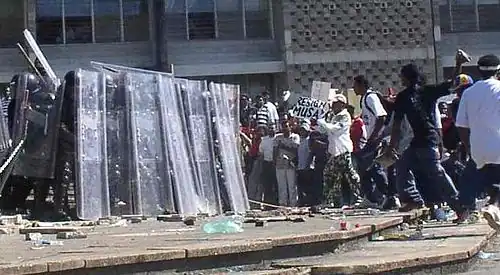 Image 37Riot police and protesters during the unrest in 2005. (from History of Belize)