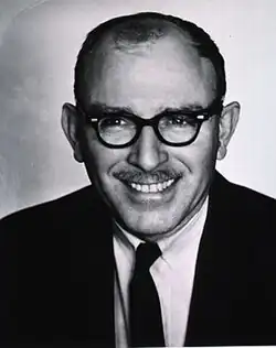 portrait showing head and shoulders, in black and white