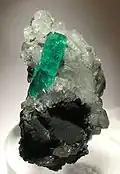 Muzo emerald on calcite 5.3&nbsp;cm ×&nbsp;3&nbsp;cm ×&nbsp;3&nbsp;cm (2.1&nbsp;in ×&nbsp;1.2&nbsp;in ×&nbsp;1.2&nbsp;in)