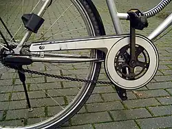 Partially enclosed chain on a European city bike