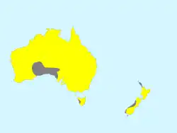 A distribution map of the Black-fronted dotterel across Australia and New Zealand, indicating that the species lives across almost the entirety of both countries, aside from certain territories like the Great Victorian desert.