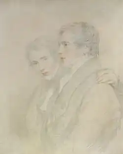 Mainly charcoal drawing, with some colour, of two young men; a little more than head and shoulders; the one on the left faces towards the viewer; the one on the right faces left. Both are clean shaven and wear what looks like great coats.