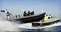 An Arctic 24 Rigid Hulled Inflatable Boat (RHIB) and the police launch 'Sir Evan Gibb', both of the Gibraltar Defence Police Marine Unit are pictured at speed in the Bay of Gibraltar.
