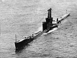 The Royal Navy Amphion-class submarine operating on the surface in the South China Sea during exercise "Oceanlink" in May 1958.