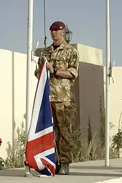 A British soldier of the Royal Artillery, with No. 5 desert combat dress shirt and trousers.