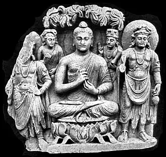 Gandhara Buddhist Triad from Sahr-i-Bahlol, c. 132 CE, similar to the dated Brussels Buddha.[43] Peshawar Museum.[44][45]