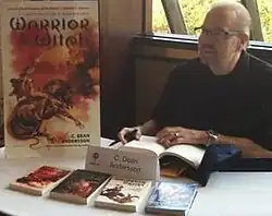 C. Dean Andersson signs books at FenCon in Dallas, Texas, September 2012 (photographed by Christopher Fulbright)