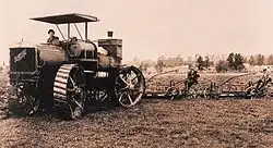 Early example of four-wheel steering. 1910 photograph of 80 hp Caldwell Vale tractor in action.