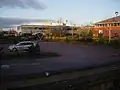 A car and bicycle park and some office buildings