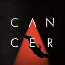 Cover artwork of "Cancer": The song's title is split between two lines on a black background, with the 'A' in the title illuminating a person falling.